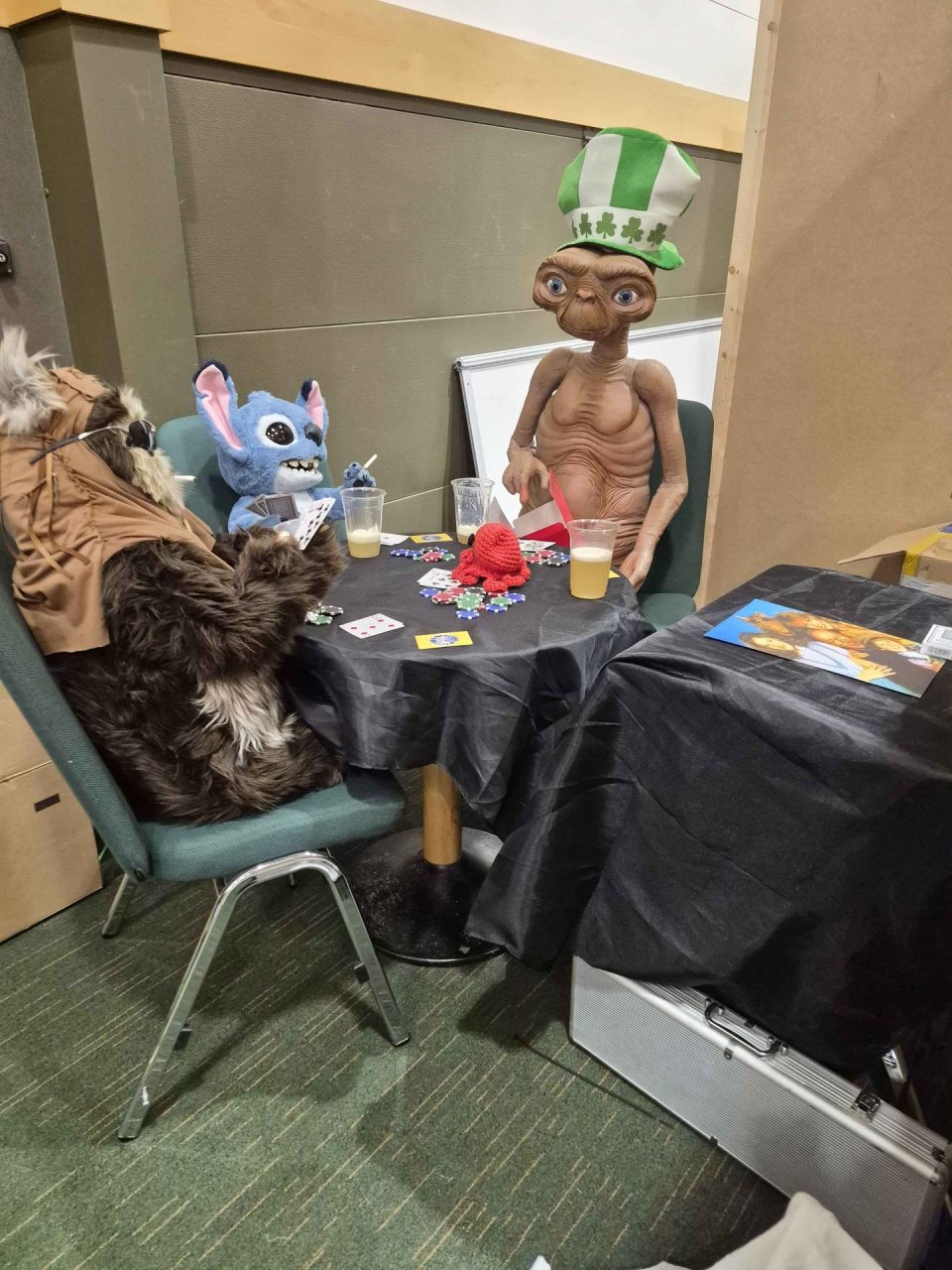 ET, Stitch, an Ewok and Octo playing poker